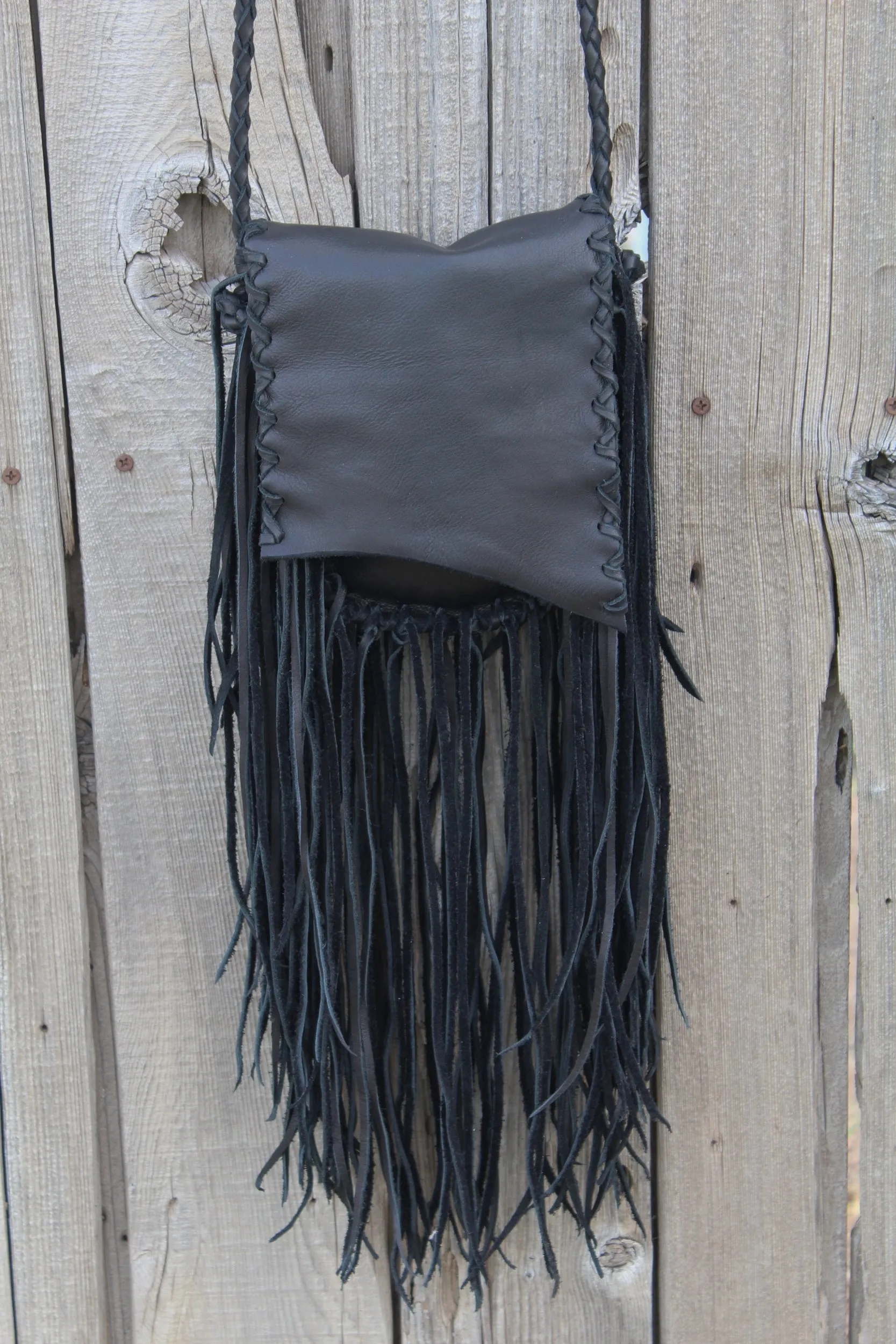 Black leather handbag with fringe, crossbody bag