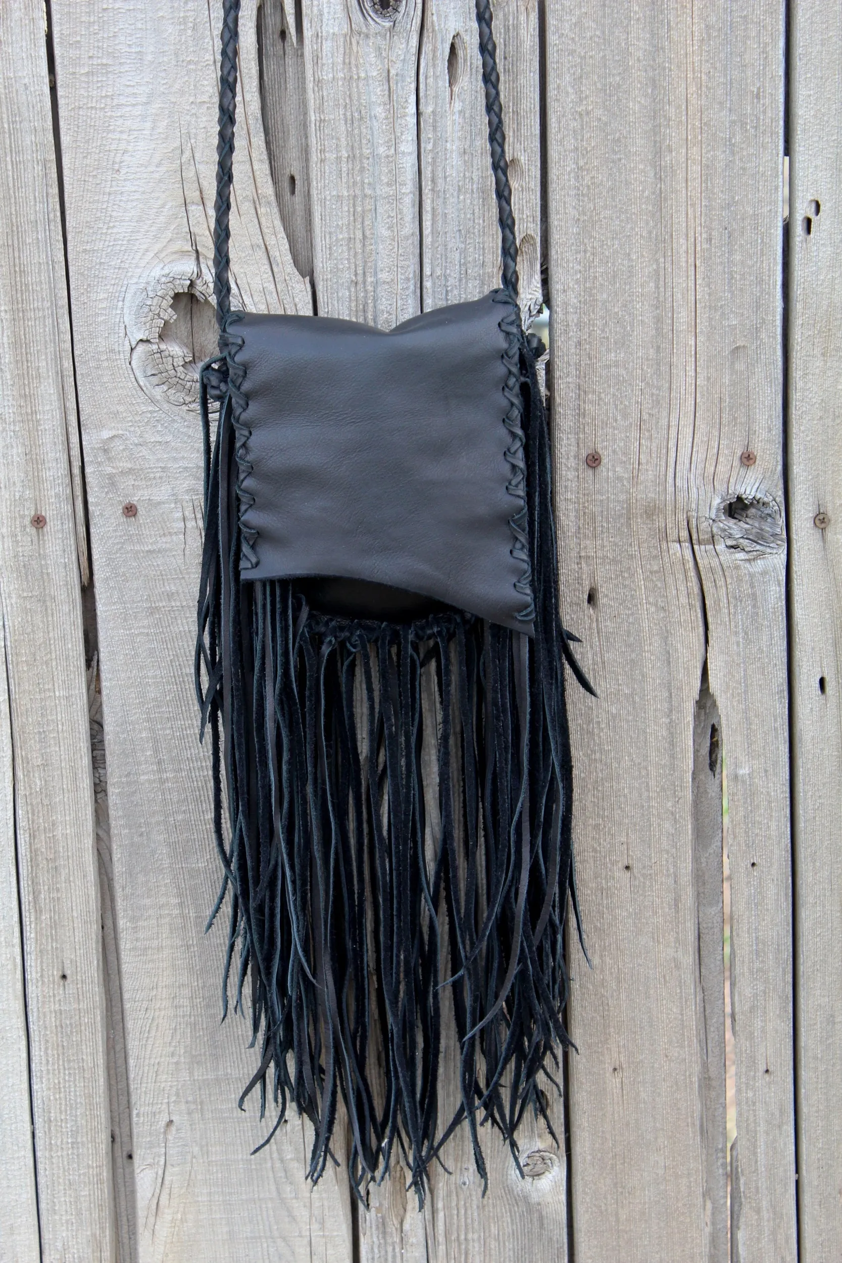 Black leather handbag with fringe, crossbody bag